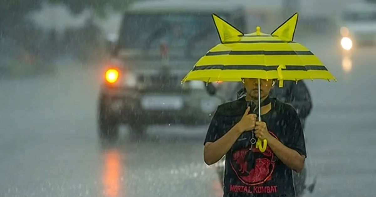 dinamani2F2025 08 102F56wxdjma2Frain weather girl umbrella edited